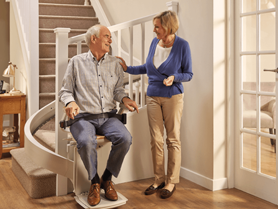 Older couple using their stair lift